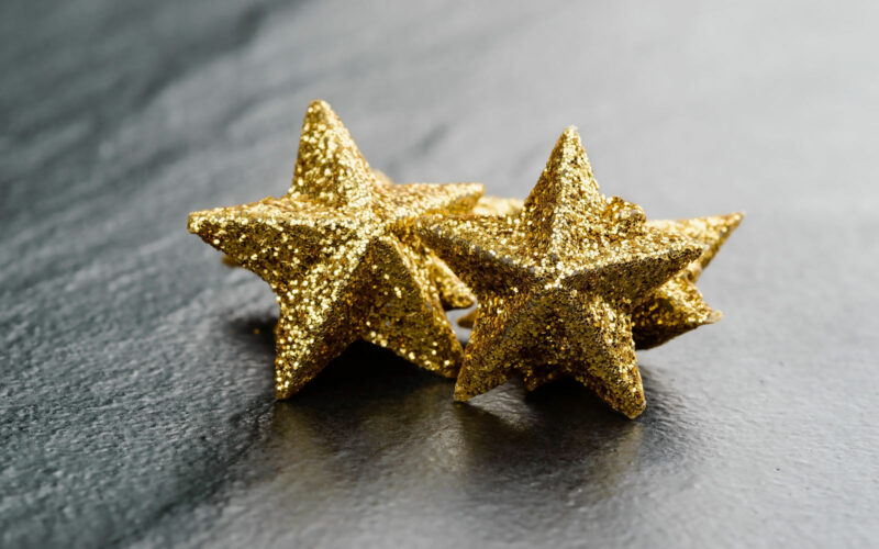 Gold stars on light grey background